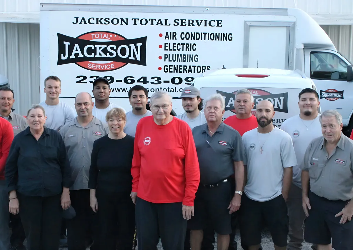 The Jackson Total Service team in front of a lettered box truck